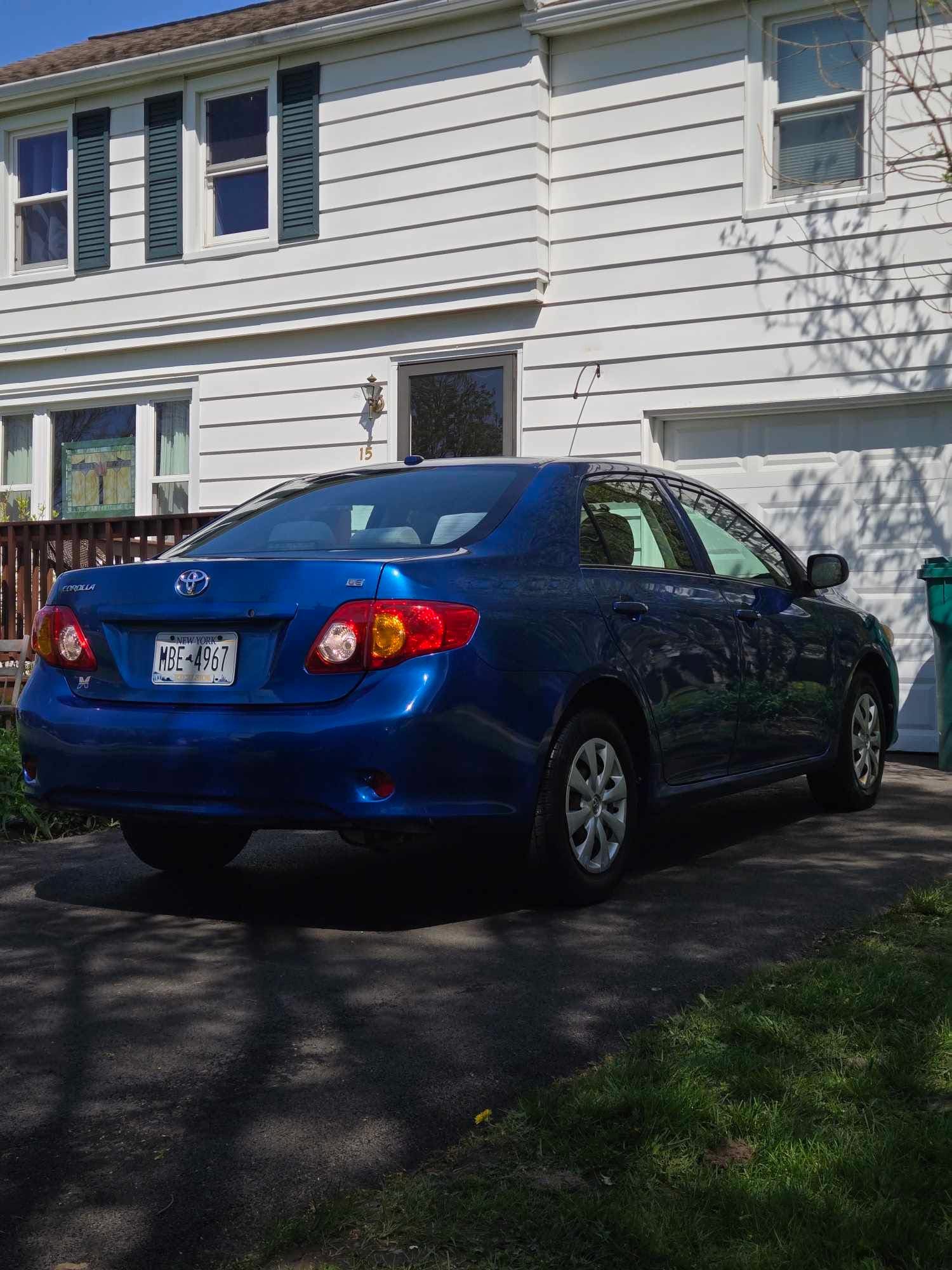 Toyota Corolla with a glossy blue finish after a full exterior detail